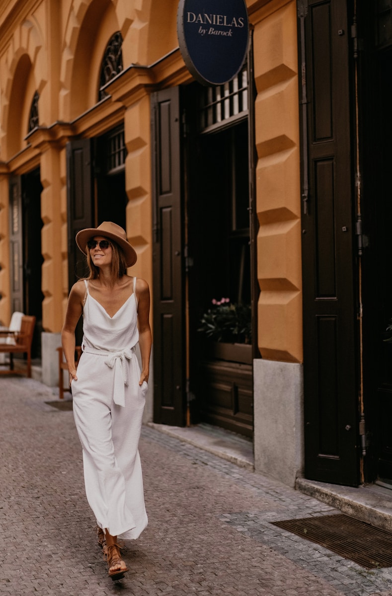 A woman walking down a street in a white dress symbolizing individual benefits health insurance